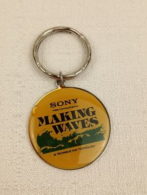 VTG Sony Making waves silver tone metal key chain with clear soft front logo